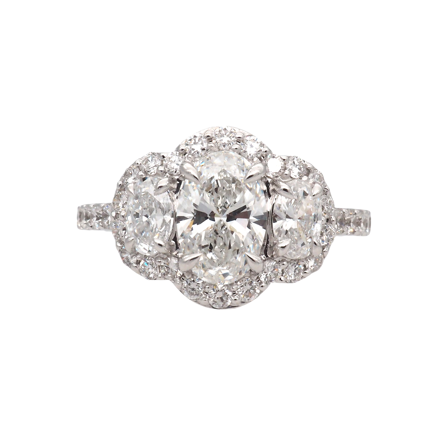 Oval Lab-Grown Diamond Three-Stone Halo Ring in White Gold