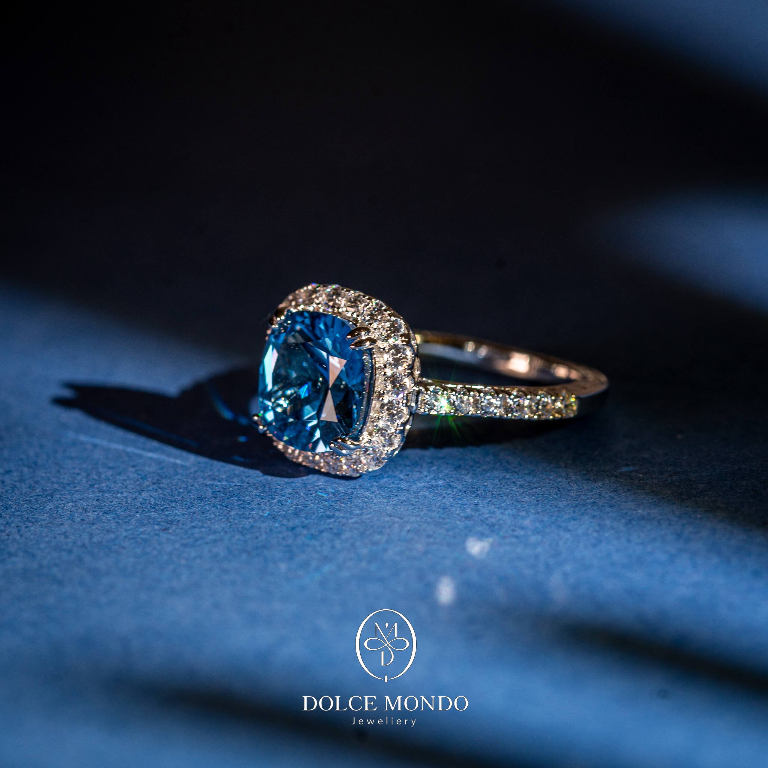 Dolce Mondo Azure Halo Brilliance – Sky Blue Zircon Rhodium Plated 925 Silver Ring