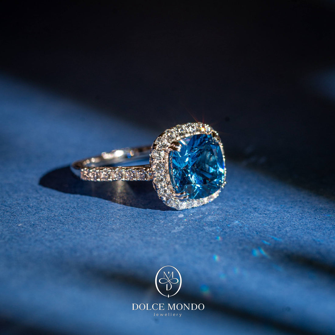Dolce Mondo Azure Halo Brilliance – Sky Blue Zircon Rhodium Plated 925 Silver Ring