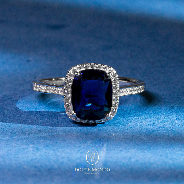 Dolce Mondo Sapphire Radiance Halo – Blue Zircon Rhodium-Plated 925 Silver Ring